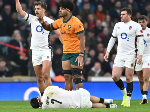 England’s Tom Curry lies on the field after a hard-hitting bump off by Rob Valetini of the Wallabies during the Autumn Nations Series, with teammates and officials assessing his condition. hell