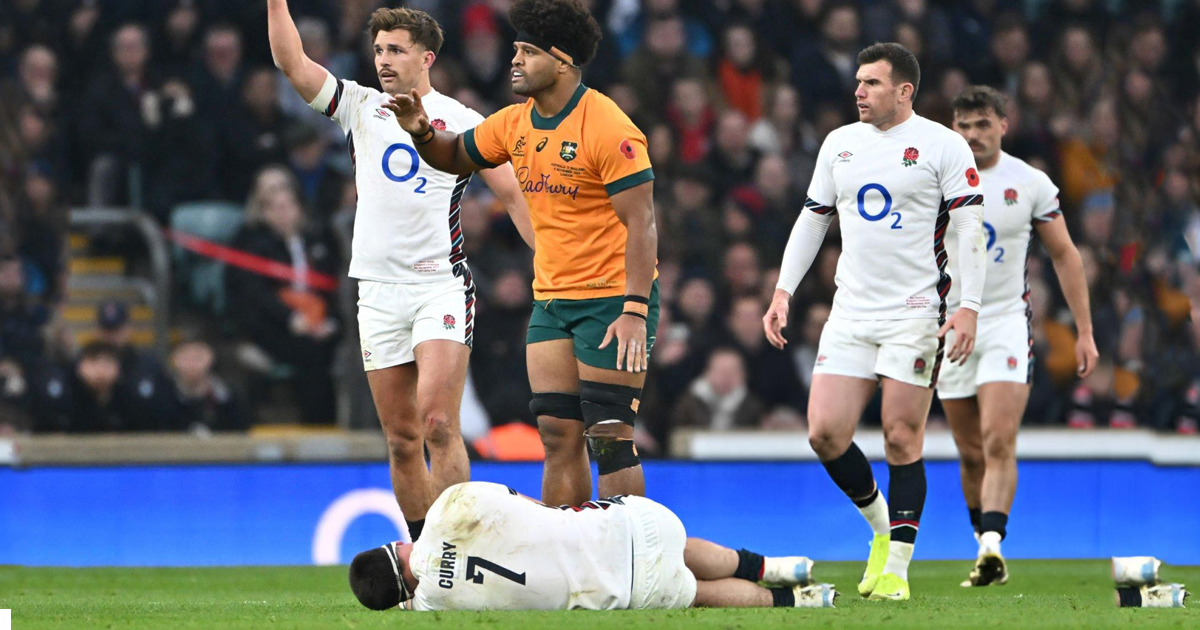 England’s Tom Curry lies on the field after a hard-hitting bump off by Rob Valetini of the Wallabies during the Autumn Nations Series, with teammates and officials assessing his condition. hell